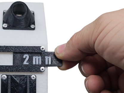 Putting a new A5 wire size plate in it's frame.